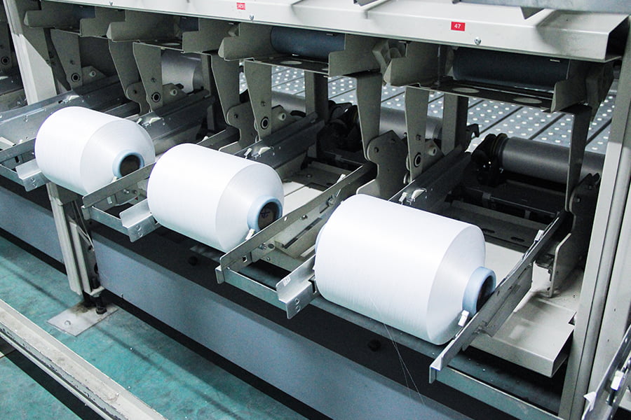 Bagaimana pilihan jumlah denier dan filamen berdampak pada kinerja dan penggunaan benang FDY?